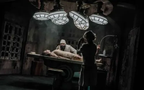 Mad scientist doctor and nurse work on a zombie patient at Eloise Asylum haunted house
